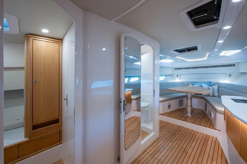 Slide: The Image of Luxurious interior of 2023 Intrepid 477 Evolution yacht with modern design and wood accents. - 38