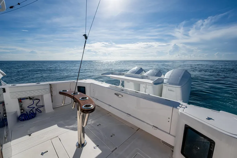 Slide: The Image of 2023 Intrepid 477 Evolution boat deck with ocean view and outboard motors. - 41