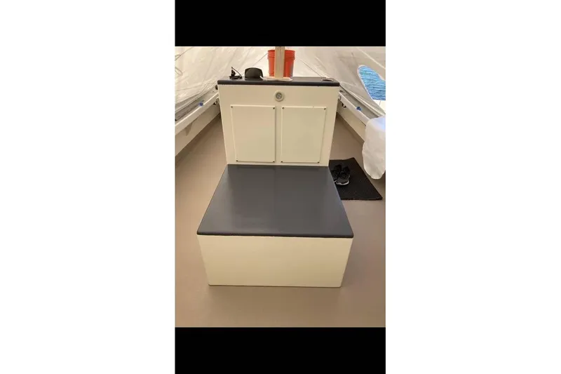 Slide: The Image of 1984 BHM CC Flye Point Launch interior with seating and storage. - 10