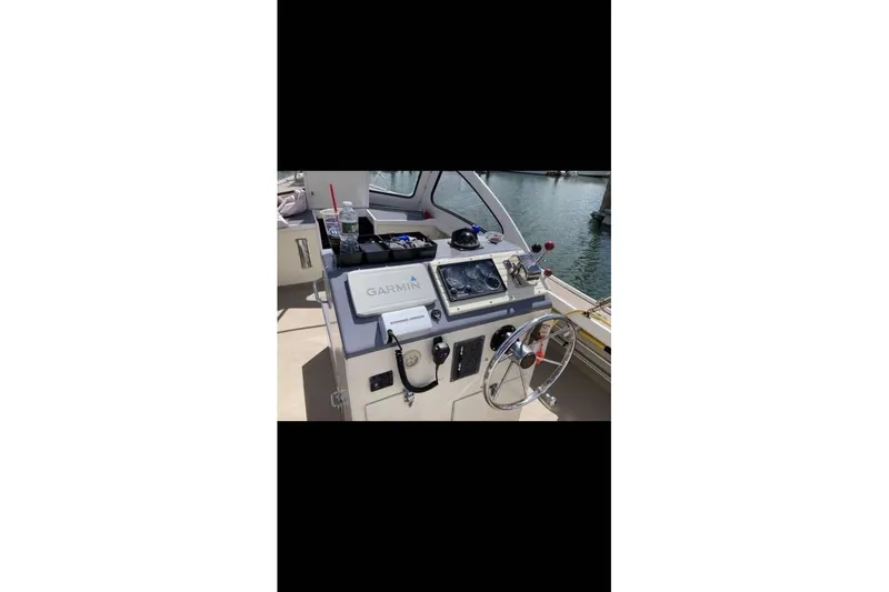 Slide: The Image of 1984 BHM CC Flye Point Launch boat helm with Garmin navigation system. - 6