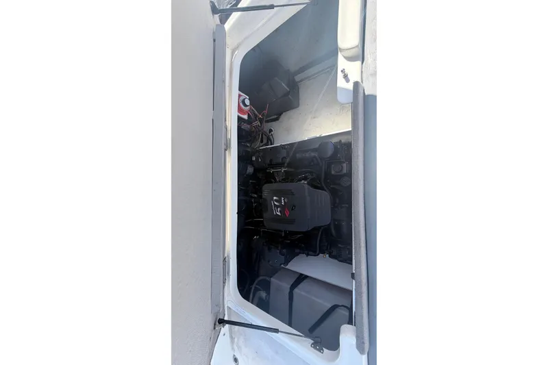 Slide: The Image of Engine compartment of a 2007 Bayliner 225 boat, showcasing internal components. - 4
