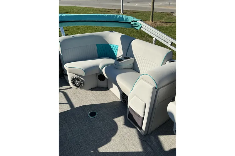 Slide: The Image of 2021 Qwest LS 824 Lanai DS Bar boat interior with plush seating and cup holders. - 10