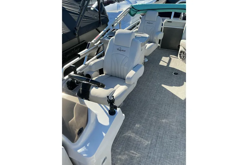 Slide: The Image of 2021 Qwest LS 824 Lanai DS Bar boat interior with plush seating and steering console. - 15