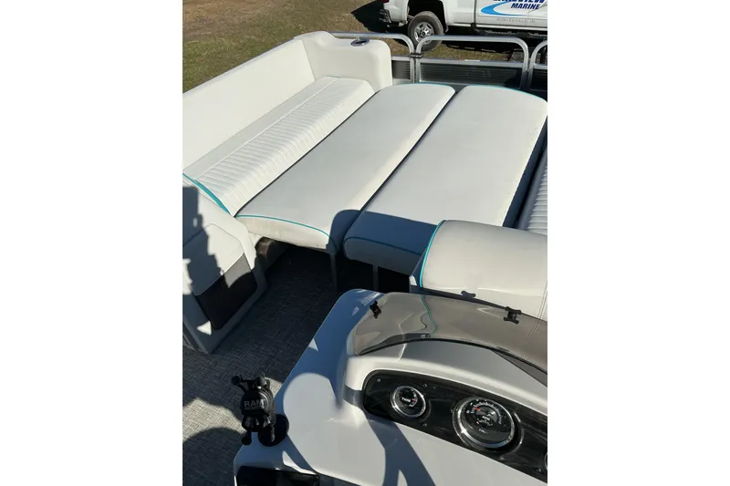 Slide: The Image of 2021 Qwest LS 824 Lanai DS Bar interior with white seating and dashboard. - 17