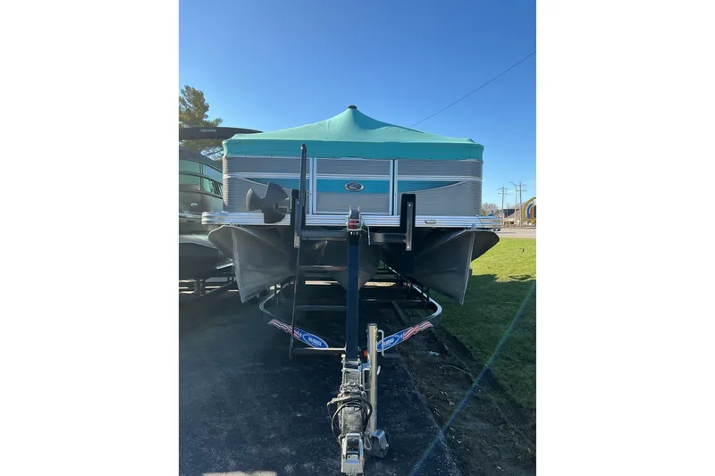 Slide: The Image of 2021 Qwest LS 824 Lanai DS Bar pontoon boat on trailer, front view. - 4