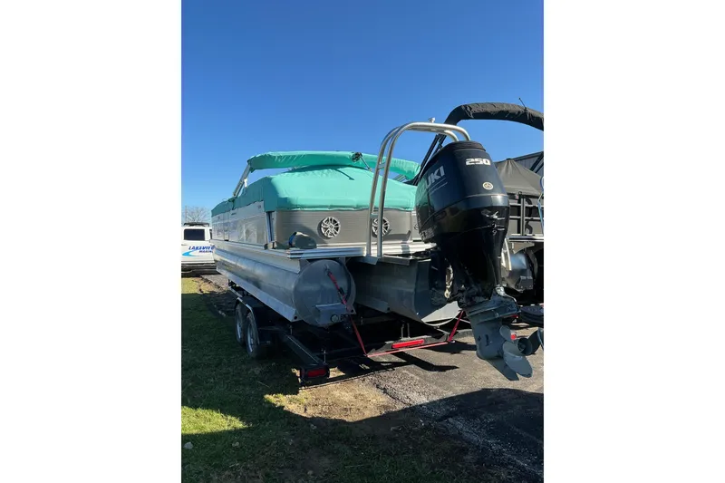 Slide: The Image of 2021 Qwest LS 824 Lanai DS Bar pontoon boat with Suzuki 250 engine on trailer. - 7