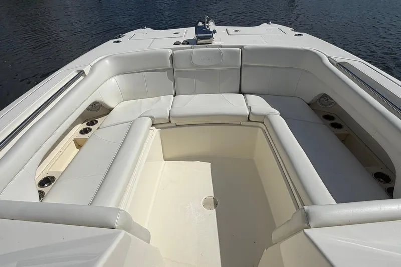 Slide: The Image of 2013 World Cat 290 DC boat with spacious white seating area. - 23