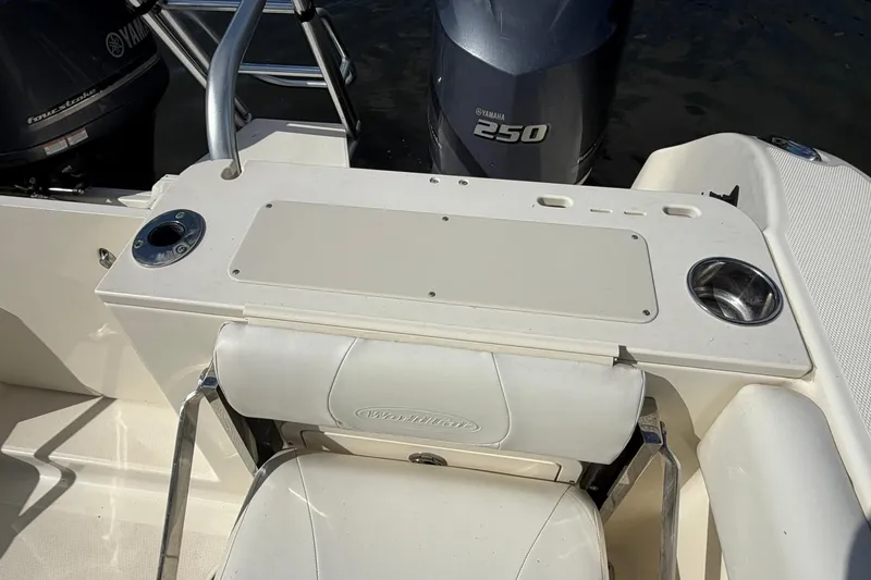 Slide: The Image of 2013 World Cat 290 DC boat interior with Yamaha 250 engine, featuring seating and control panel. - 32