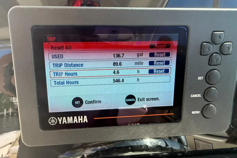 Slide: The Image of Yamaha display showing trip data on a 2013 World Cat 290 DC boat. - 33