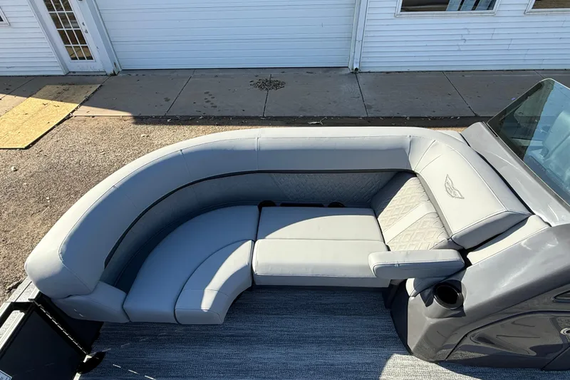 Slide: The Image of 2026 Bennington 24 M Sport Lounge Quad Bench with luxurious gray seating. - 10