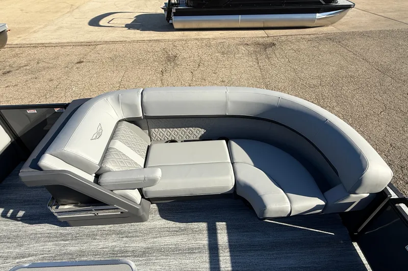 Slide: The Image of 2026 Bennington 24 M Sport Lounge Quad Bench with luxurious gray seating. - 11