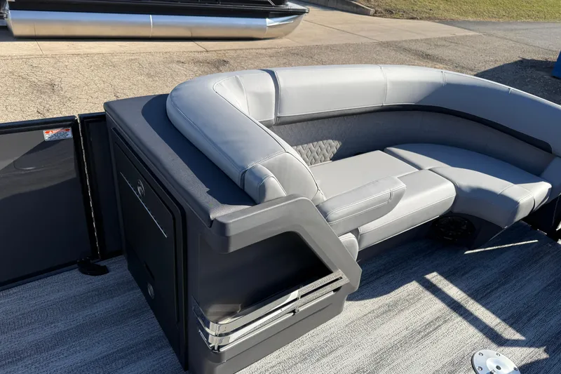 Slide: The Image of 2026 Bennington 24 M Sport Lounge Quad Bench with sleek gray seating and modern design. - 12