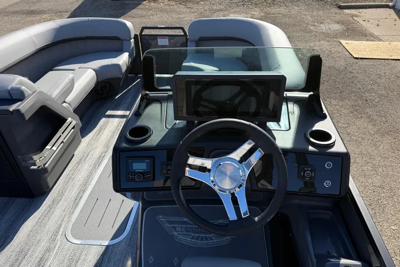 Slide: The Image of 2026 Bennington 24 M Sport Lounge Quad Bench boat interior with modern helm and seating. - 17