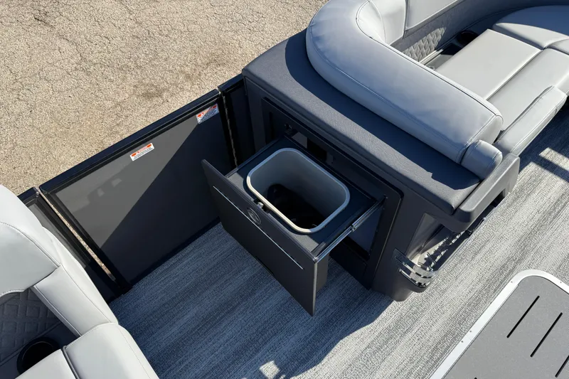 Slide: The Image of 2026 Bennington 24 M Sport Lounge Quad Bench with open storage compartment and seating. - 19