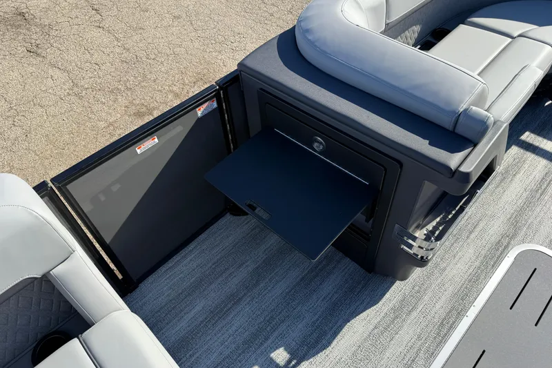 Slide: The Image of 2026 Bennington 24 M Sport Lounge Quad Bench with sleek seating and storage features. - 20