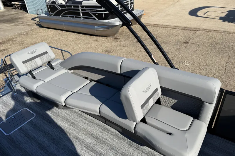 Slide: The Image of 2026 Bennington 24 M Sport Lounge Quad Bench with luxurious gray seating. - 22