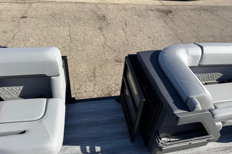 Slide: The Image of 2026 Bennington 24 M Sport Lounge Quad Bench with sleek gray seating and modern design. - 24