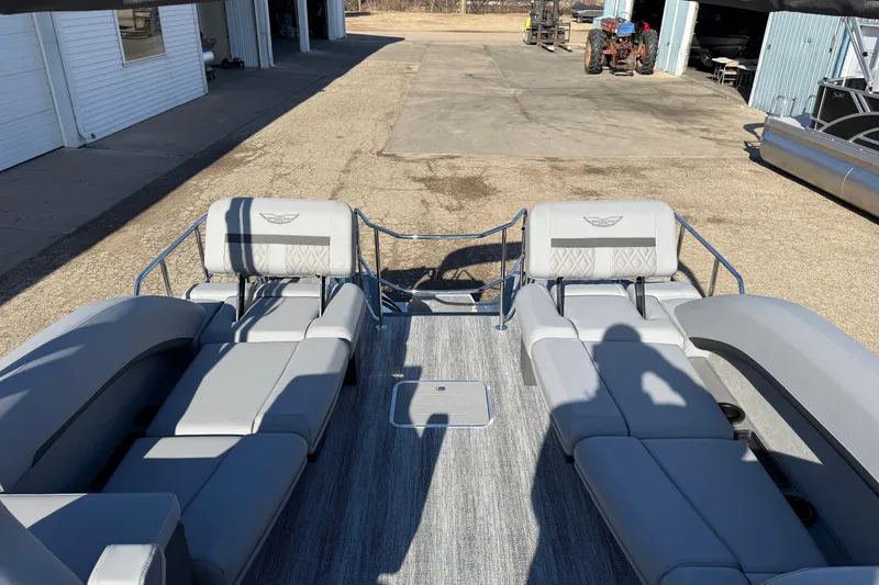 Slide: The Image of 2026 Bennington 24 M Sport Lounge Quad Bench with sleek gray seating and modern design. - 26