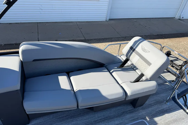 Slide: The Image of 2026 Bennington 24 M Sport Lounge Quad Bench with sleek gray seating and modern design. - 27