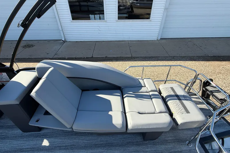 Slide: The Image of 2026 Bennington 24 M Sport Lounge Quad Bench with sleek gray seating and modern design. - 30