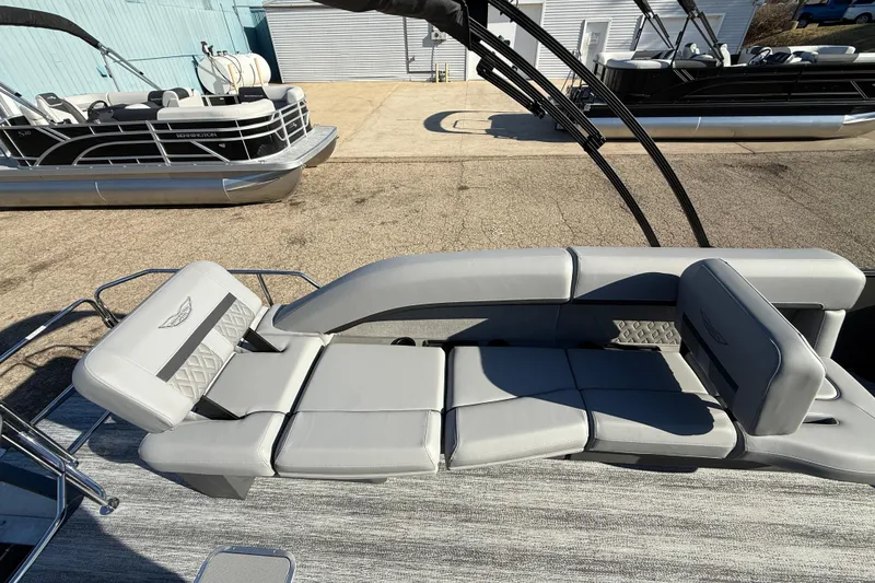 Slide: The Image of 2026 Bennington 24 M Sport Lounge Quad Bench with luxurious seating and sleek design. - 31