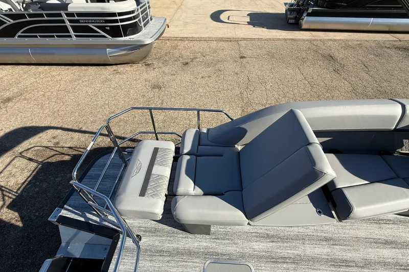 Slide: The Image of 2026 Bennington 24 M Sport Lounge Quad Bench with sleek gray seating and modern design. - 33