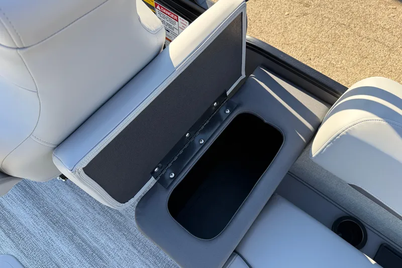 Slide: The Image of Open storage compartment in 2026 Bennington 24 M Sport Lounge Quad Bench boat seat. - 34