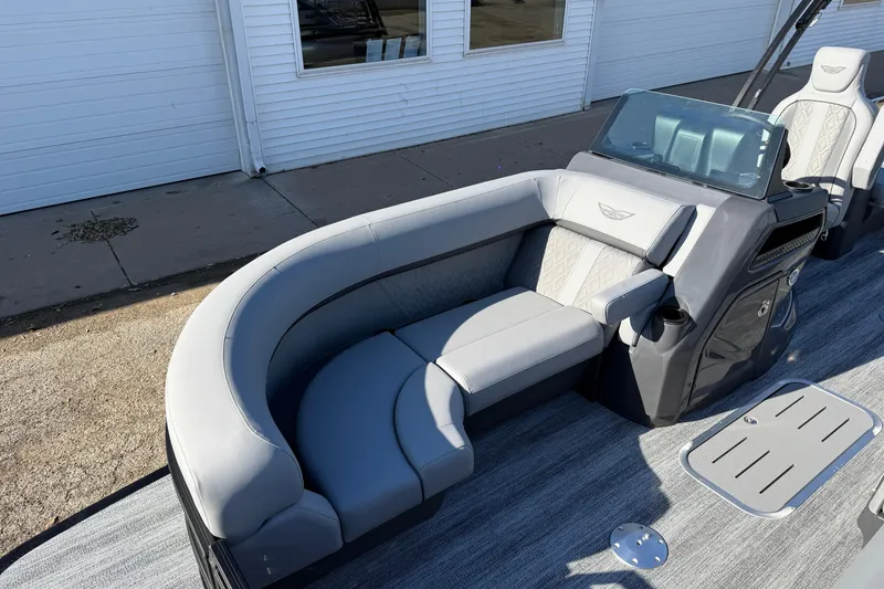 Slide: The Image of 2026 Bennington 24 M Sport Lounge Quad Bench with sleek gray seating and modern design. - 8