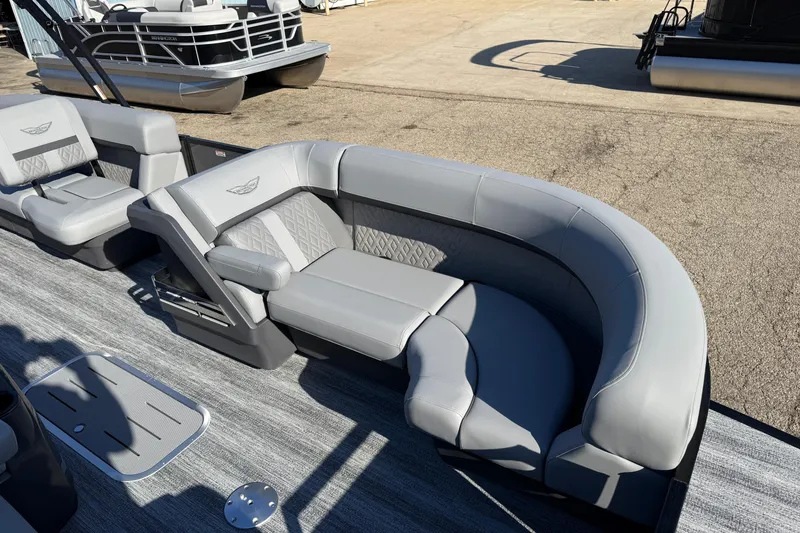 Slide: The Image of 2026 Bennington 24 M Sport Lounge Quad Bench with luxurious gray seating and modern design. - 9