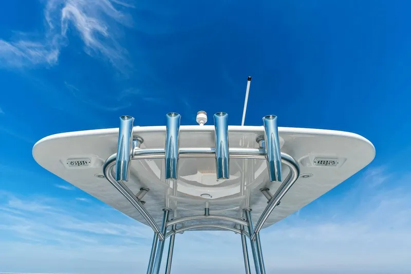 Slide: The Image of 2024 Custom Center Console High Ground Boatworks against clear blue sky. - 17