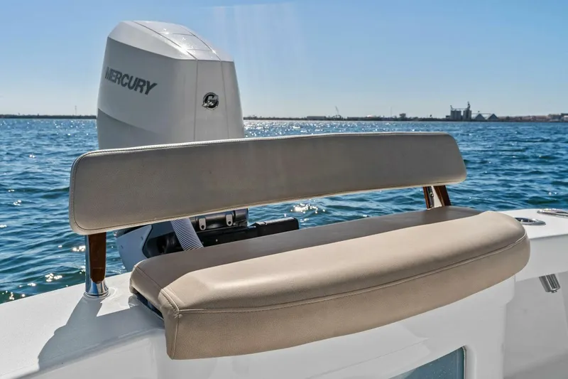 Slide: The Image of 2024 Custom Center Console High Ground Boatworks with Mercury engine on open water. - 26