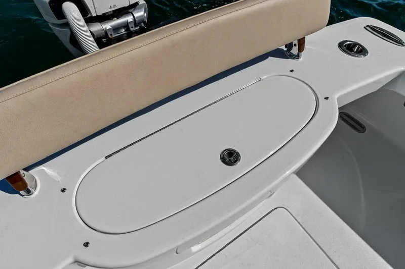Slide: The Image of 2024 Custom Center Console High Ground Boatworks with cushioned seating and storage compartment. - 27