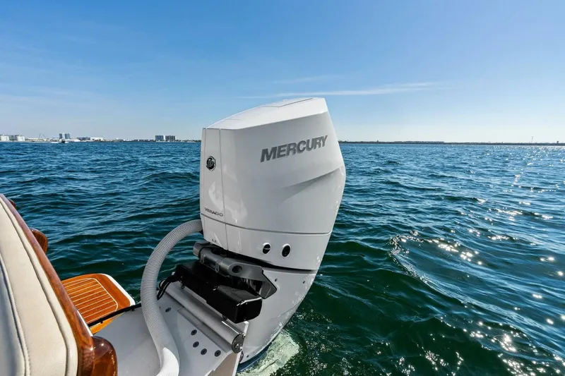 Slide: The Image of 2024 Custom Center Console High Ground Boatworks with Mercury engine on open water. - 28