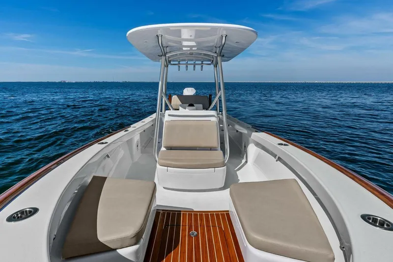 Slide: The Image of 2024 Custom Center Console High Ground Boatworks on open water, featuring sleek design and comfortable seating. - 3