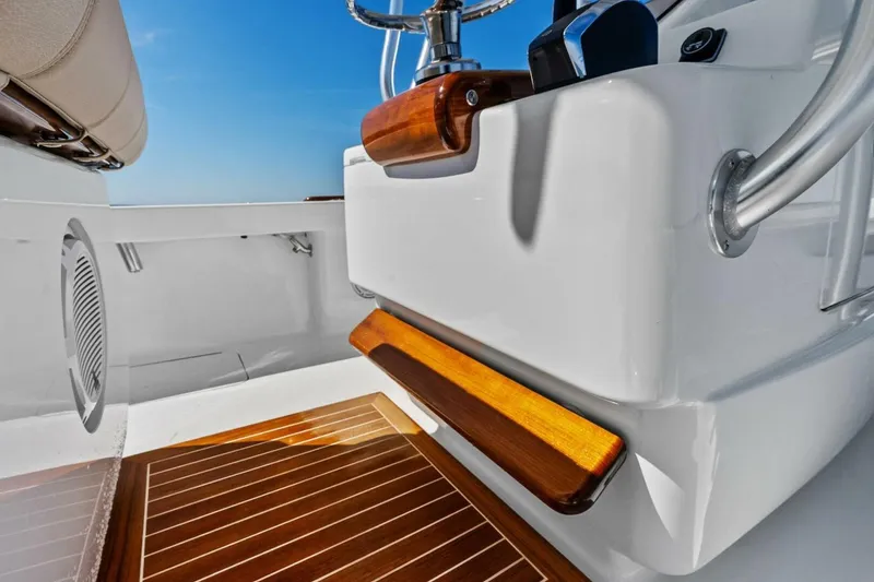 Slide: The Image of 2024 Custom Center Console High Ground Boatworks with sleek wood accents and modern design. - 37