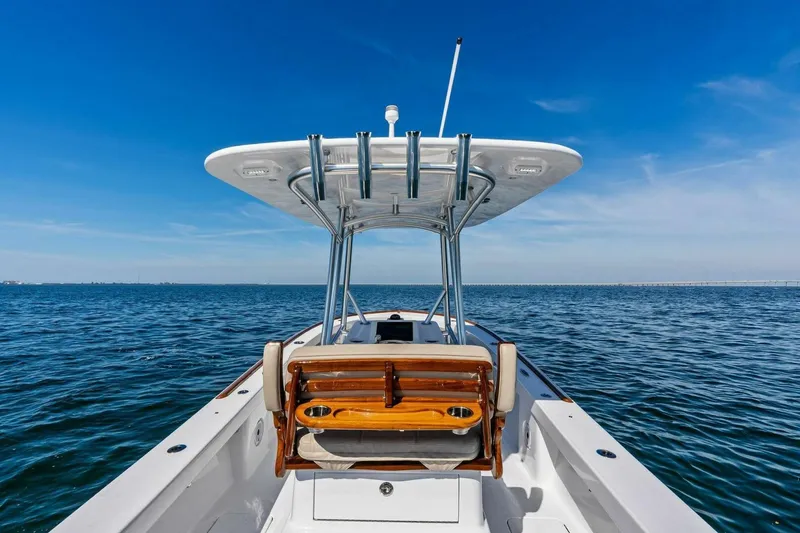 Slide: The Image of 2024 Custom Center Console High Ground Boatworks on open water, clear blue sky. - 39