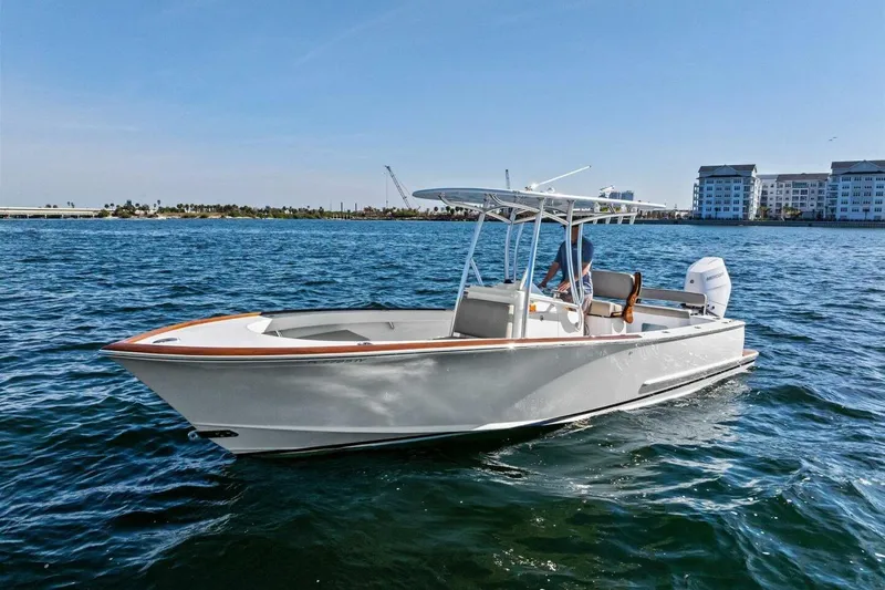 Slide: The Image of 2024 Custom Center Console High Ground Boatworks on open water, clear sky background. - 45