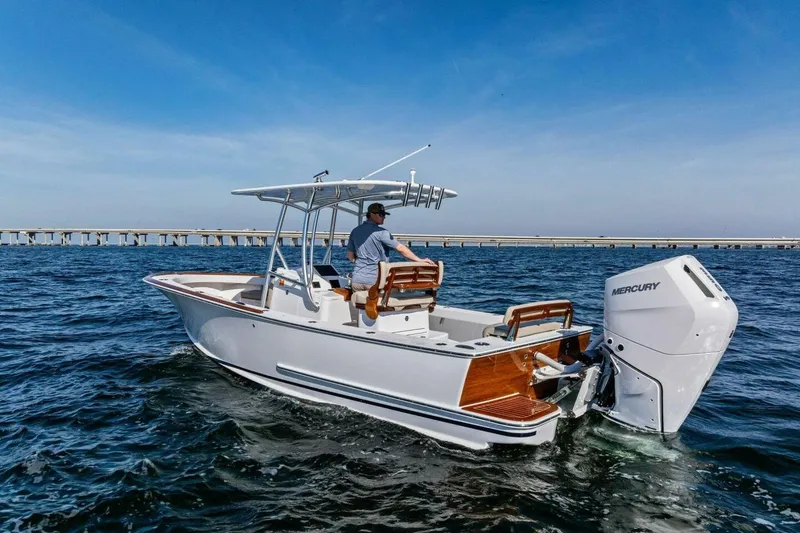 Slide: The Image of 2024 Custom Center Console High Ground Boatworks on open water, featuring Mercury outboard engine. - 47