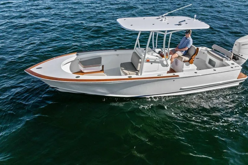 Slide: The Image of 2024 Custom Center Console High Ground Boatworks on open water, featuring sleek design and modern amenities. - 51