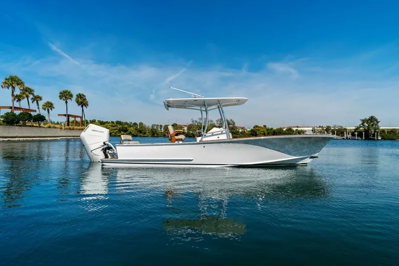 Slide: The Image of 2024 Custom Center Console High Ground Boatworks on calm water, clear sky background. - 53