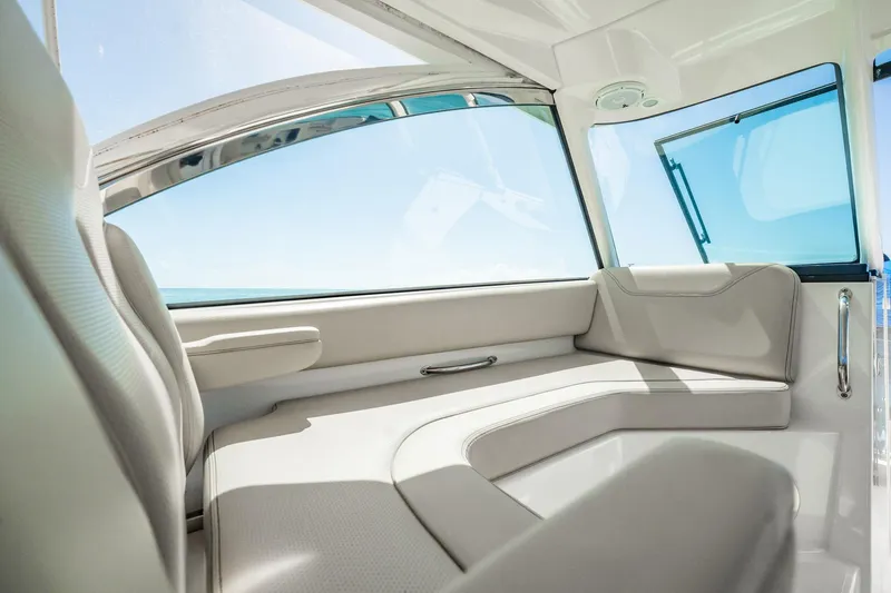 Slide: The Image of 2017 Pursuit DC 325 Dual Console interior with sleek seating and ocean view. - 28