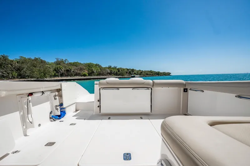 Slide: The Image of 2017 Pursuit DC 325 Dual Console boat interior with ocean view and clear blue sky. - 45