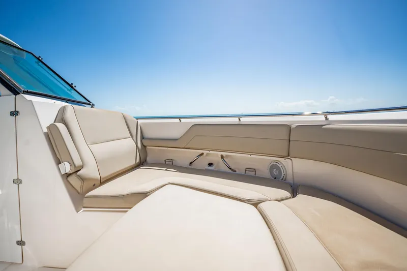 Slide: The Image of Luxurious seating on 2017 Pursuit DC 325 Dual Console boat under clear blue sky. - 77