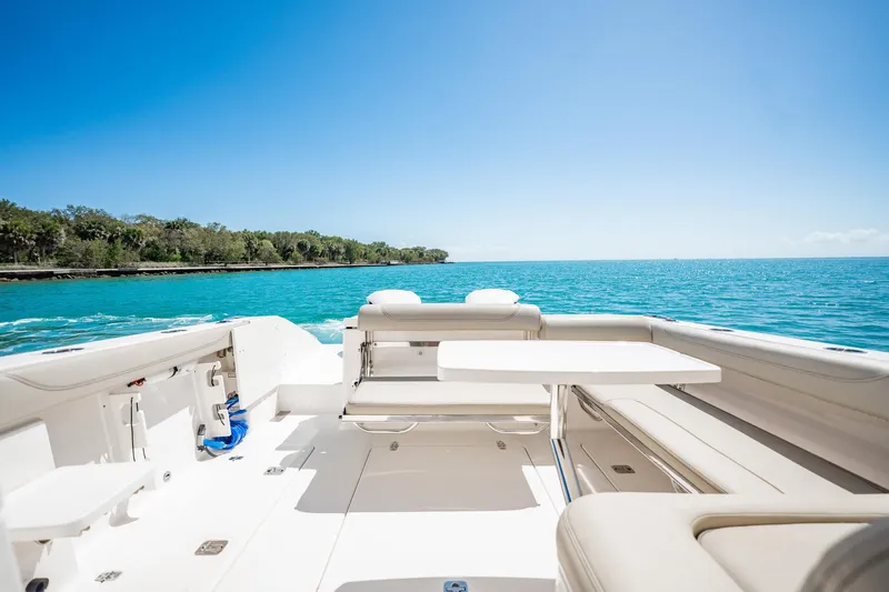 Slide: The Image of 2017 Pursuit DC 325 Dual Console boat on clear blue water, sunny day. - 78