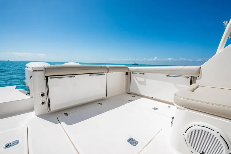 Slide: The Image of 2017 Pursuit DC 325 Dual Console boat interior with ocean view and clear blue sky. - 86