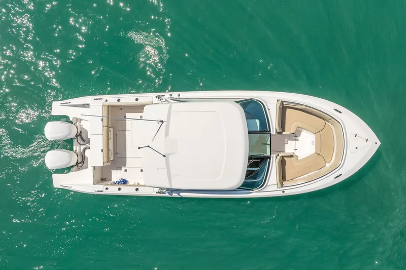 Slide: The Image of Overhead view of 2017 Pursuit DC 325 Dual Console boat on turquoise water. - 9