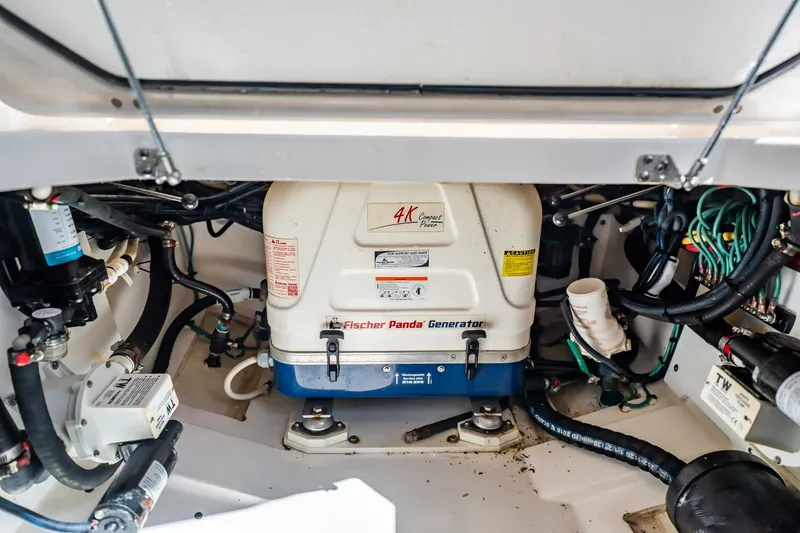 Slide: The Image of Engine compartment of 2017 Pursuit DC 325 Dual Console with Fischer Panda generator. - 94