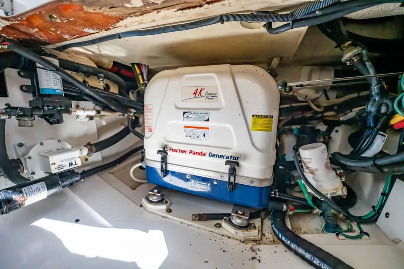 Slide: The Image of Fischer Panda generator in 2017 Pursuit DC 325 Dual Console boat engine compartment. - 95