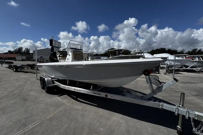 The Image of 2026 Blazer PureBay 2200 boat on trailer under cloudy sky. - 1