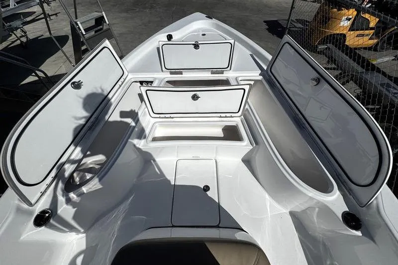Slide: The Image of 2026 Blazer PureBay 2200 boat interior with open storage compartments. - 12